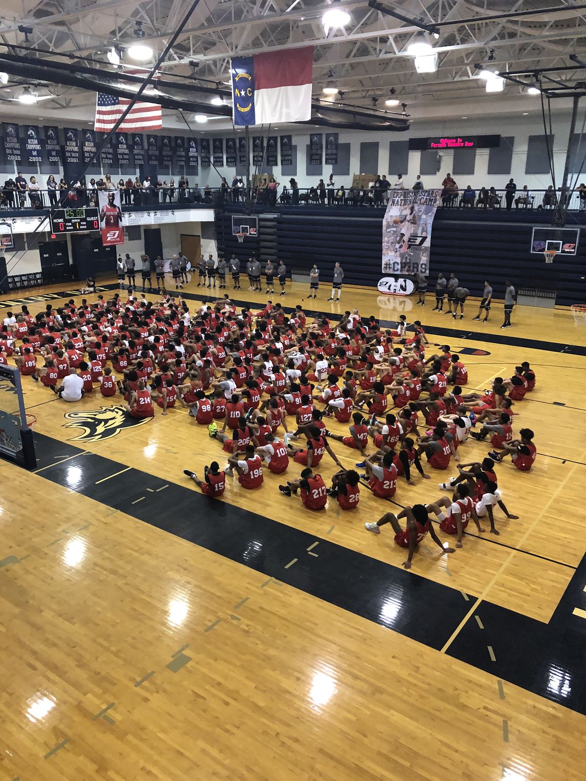 The whole Camp Oliver group seated at center court