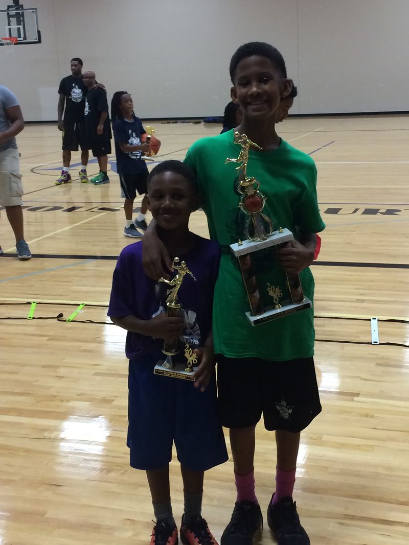 A camper holding his trophy