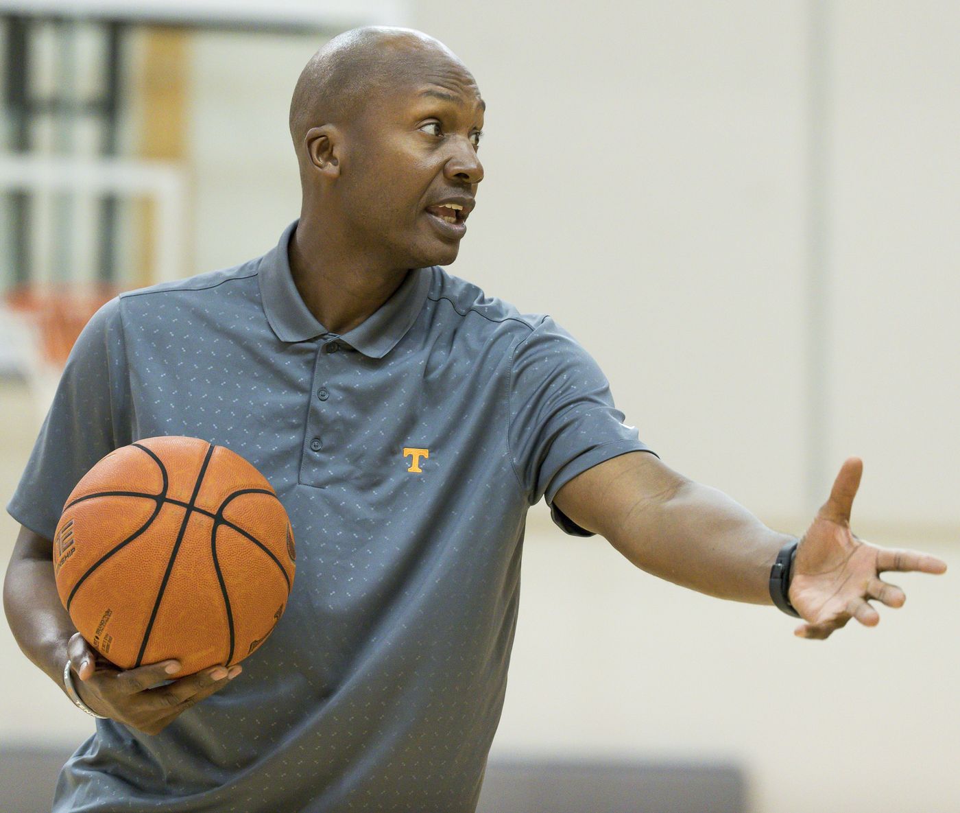 Coach Oliver teaching on the floor at Tennessee